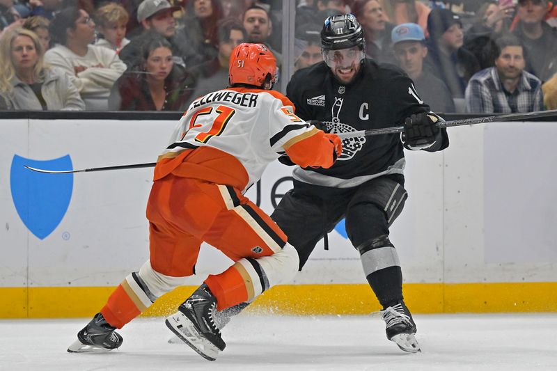 Dec 27, 2025; Los Angeles, California, USA;  Anaheim Ducks defenseman Olen Zellweger (51) and Los Angeles Kings center Anze Kopitar (11) vie for position on the ice during the second period at Crypto.com Arena. Mandatory Credit: Jayne Kamin-Oncea-Imagn Images