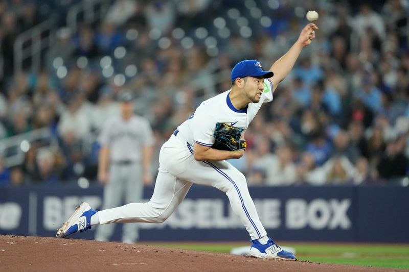 Apr 16, 2024; Toronto, Ontario, CAN; Toronto Blue Jays starting pitcher Yusei Kikuchi (16) pitches to the New York Yankees during the first inning at Rogers Centre. Mandatory Credit: John E. Sokolowski-USA TODAY Sports