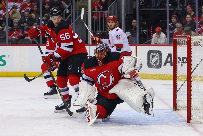 Nov 21, 2024; Newark, New Jersey, USA; New Jersey Devils goaltender Jacob Markstrom (25) defends his net against the Carolina Hurricanes during the first period at Prudential Center. Mandatory Credit: Ed Mulholland-Imagn Images