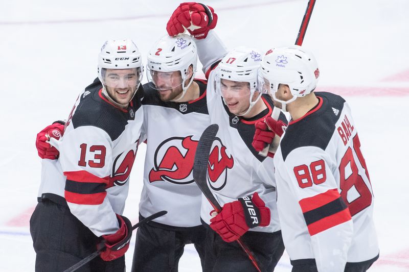 Dec 29, 2023; Ottawa, Ontario, CAN; New Jersey Devils defenseman Brendan Smith (2) celebrates with team his goal scored in the third period against the Ottawa Senators at the Canadian Tire Centre. Mandatory Credit: Marc DesRosiers-USA TODAY Sports