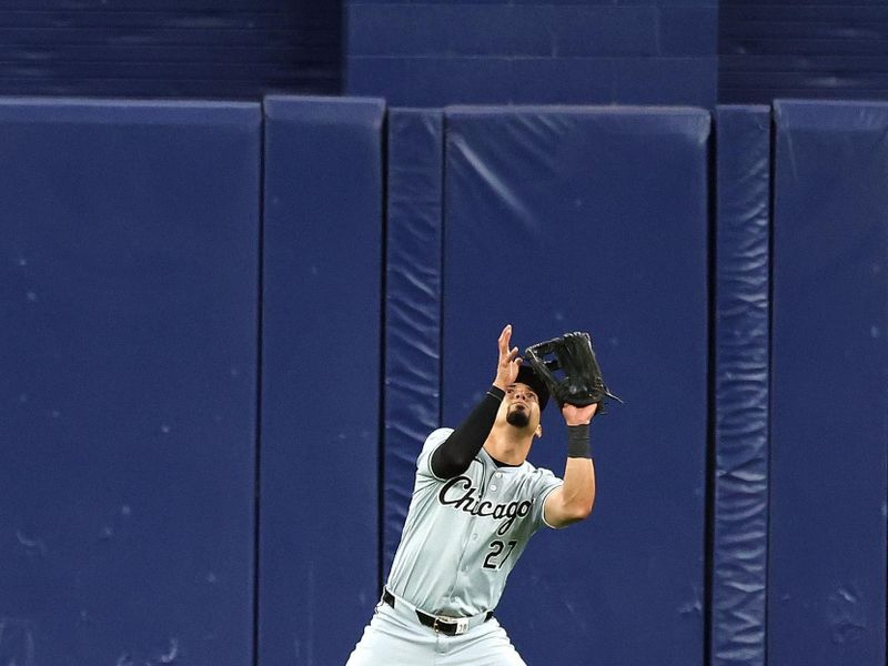 May 8, 2024; St. Petersburg, Florida, USA; Chicago White Sox outfielder Rafael Ortega (27) catches a fly ball against the Tampa Bay Rays during the ninth inning at Tropicana Field. Mandatory Credit: Kim Klement Neitzel-USA TODAY Sports