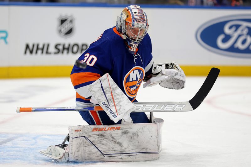 Jan 21, 2024; Elmont, New York, USA; New York Islanders goaltender Ilya Sorokin (30) makes a save against the Dallas Stars during the first period at UBS Arena. Mandatory Credit: Brad Penner-USA TODAY Sports