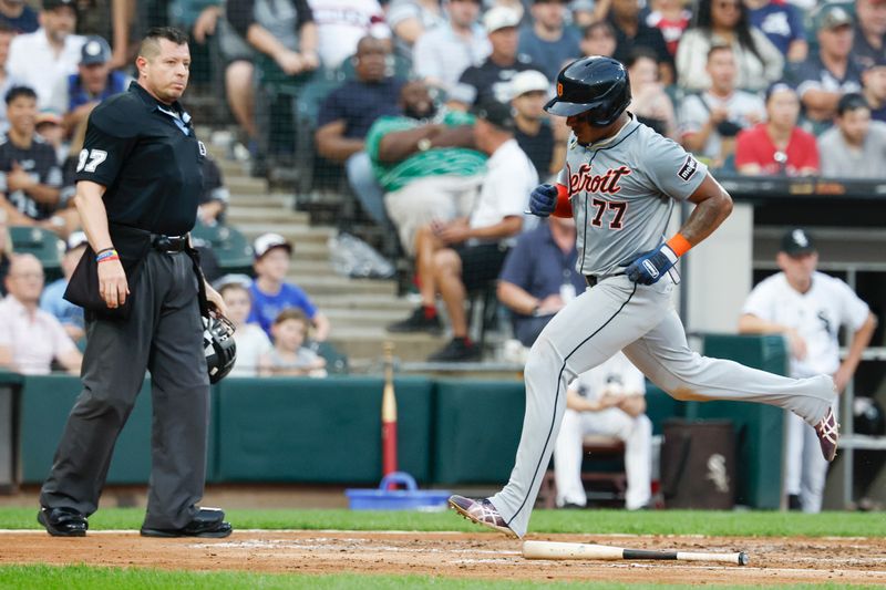 Aug 24, 2024; Chicago, Illinois, USA; Detroit Tigers second baseman Andy Ibanez (77) scores against the Chicago White Sox during the third inning at Guaranteed Rate Field. Mandatory Credit: Kamil Krzaczynski-USA TODAY Sports