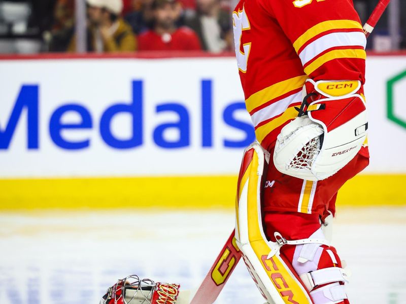 Nov 11, 2024; Calgary, Alberta, CAN; Calgary Flames goaltender Dustin Wolf (32) prior to the game against the Los Angeles Kings during the first period at Scotiabank Saddledome. Mandatory Credit: Sergei Belski-Imagn Images