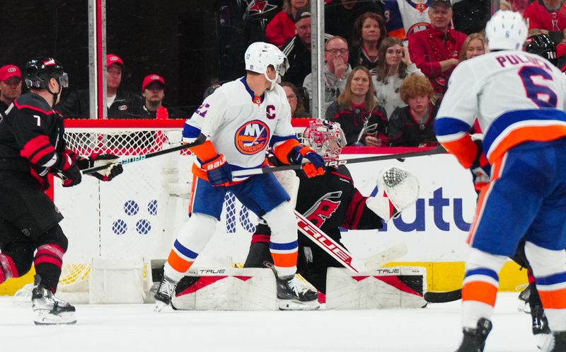 Apr 30, 2024; Raleigh, North Carolina, USA; New York Islanders left wing Anders Lee (27) goes to tip the shot on Carolina Hurricanes goaltender Frederik Andersen (31) during the third period in game five of the first round of the 2024 Stanley Cup Playoffs at PNC Arena. Mandatory Credit: James Guillory-USA TODAY Sports