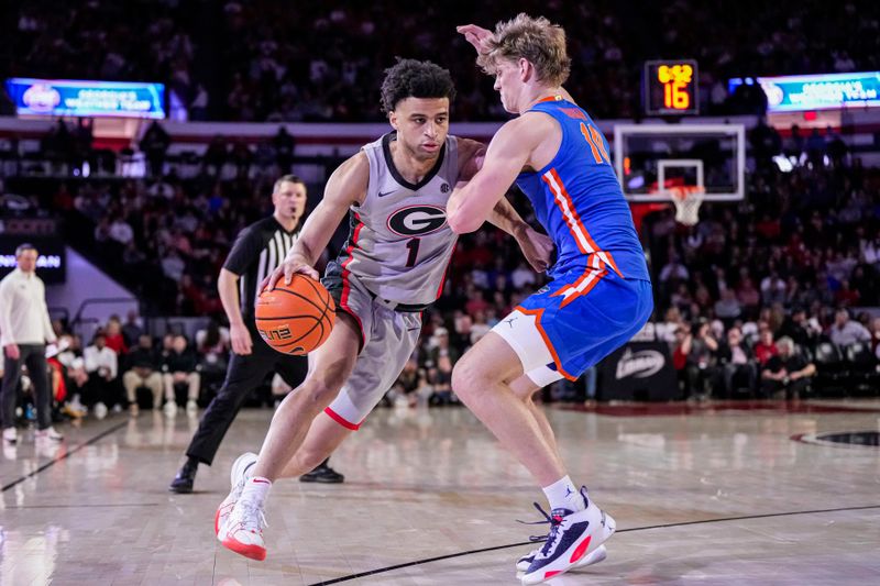 Feb 17, 2024; Athens, Georgia, USA; Georgia Bulldogs guard Jabri Abdur-Rahim (1) dribbles against Florida Gators forward Thomas Haugh (10) during the first half at Stegeman Coliseum. Mandatory Credit: Dale Zanine-USA TODAY Sports