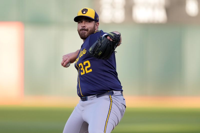 Aug 23, 2024; Oakland, California, USA; Milwaukee Brewers starting pitcher Aaron Civale (32) throws a pitch against the Oakland Athletics during the first inning at Oakland-Alameda County Coliseum. Mandatory Credit: Darren Yamashita-USA TODAY Sports