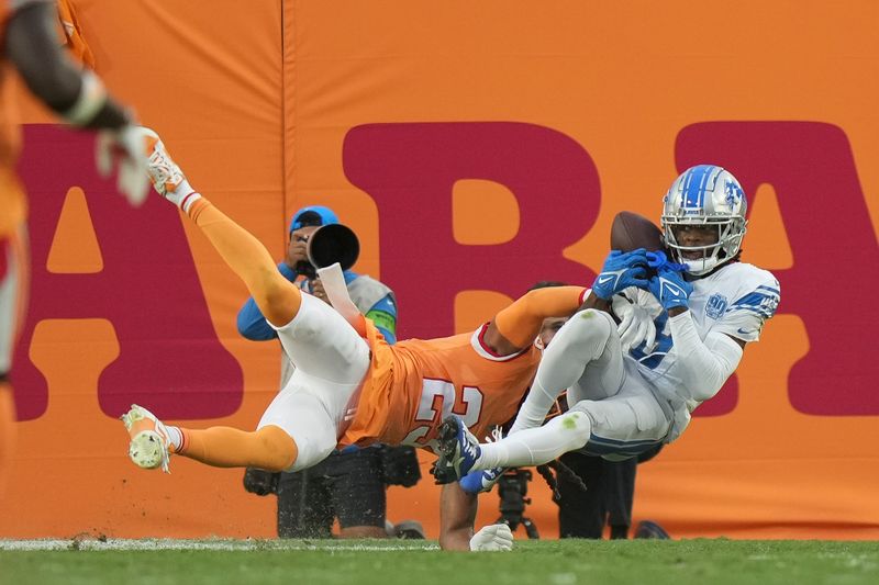 Detroit Lions wide receiver Jameson Williams (9) makes a touchdown catch as Tampa Bay Buccaneers safety Ryan Neal (23) defends during an NFL football game, Sunday, Oct. 15 2023, in Tampa, Fla. (AP Photo/Peter Joneleit)