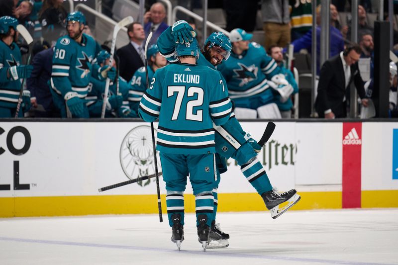 Dec 12, 2023; San Jose, California, USA; San Jose Sharks left wing Anthony Duclair (10) congratulates left wing William Eklund (72) after scoring a power play goal against the Winnipeg Jets during the third period at SAP Center at San Jose. Mandatory Credit: Robert Edwards-USA TODAY Sports