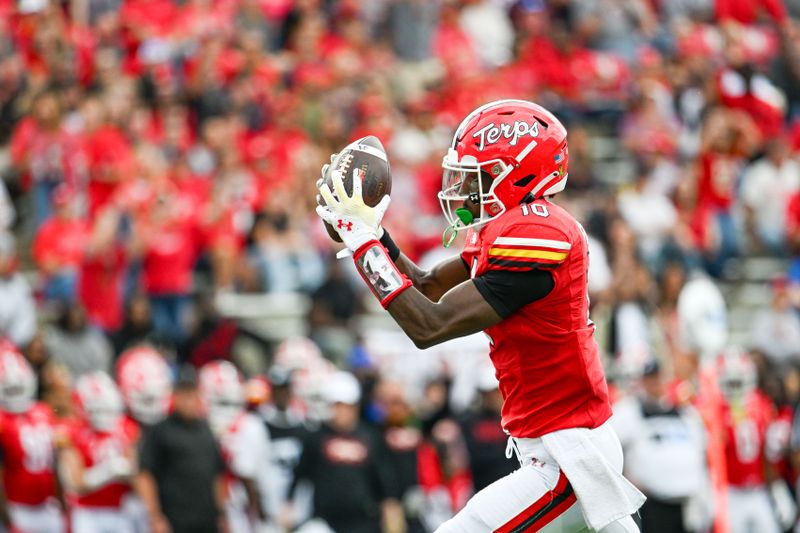 Sep 30, 2023; College Park, Maryland, USA; Maryland Terrapins wide receiver Tai Felton (10) catches a pass for a touchdown during the first half  against the Indiana Hoosiers at SECU Stadium. Mandatory Credit: Tommy Gilligan-USA TODAY Sports