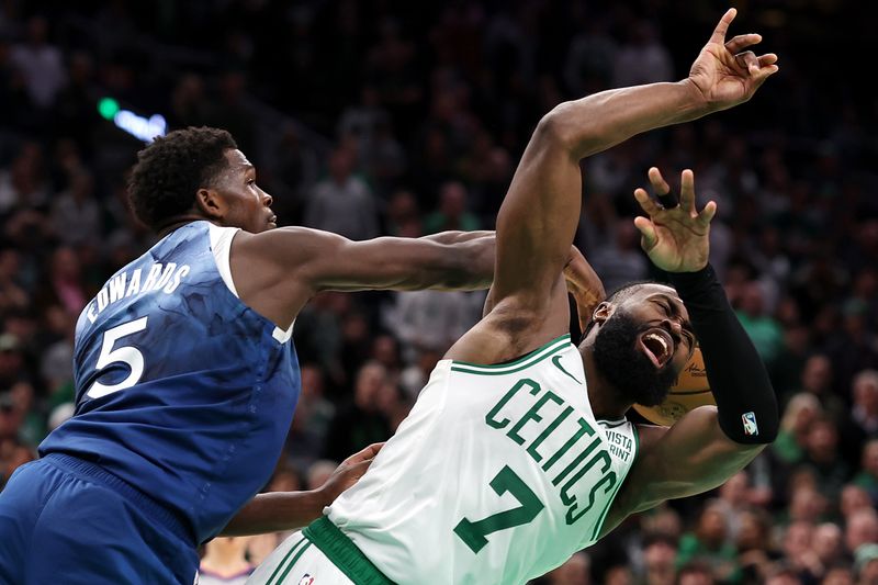 BOSTON, MASSACHUSETTS - JANUARY 10: Anthony Edwards #5 of the Minnesota Timberwolves fouls Jaylen Brown #7 of the Boston Celtics  at TD Garden on January 10, 2024 in Boston, Massachusetts. The Celtics defeat the Timberwolves 127-120 in overtime. NOTE TO USER: User expressly acknowledges and agrees that, by downloading and or using this photograph, user is consenting to the terms and conditions of the Getty Images License Agreement.  (Photo by Maddie Meyer/Getty Images)