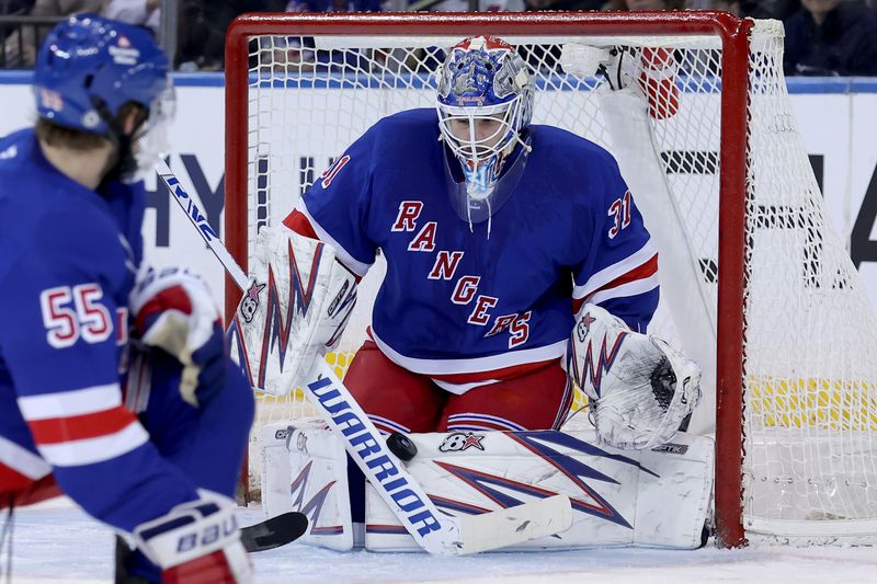 Nov 14, 2024; New York, New York, USA; New York Rangers goaltender Igor Shesterkin (31) makes a save against the San Jose Sharks during the second period at Madison Square Garden. Mandatory Credit: Brad Penner-Imagn Images