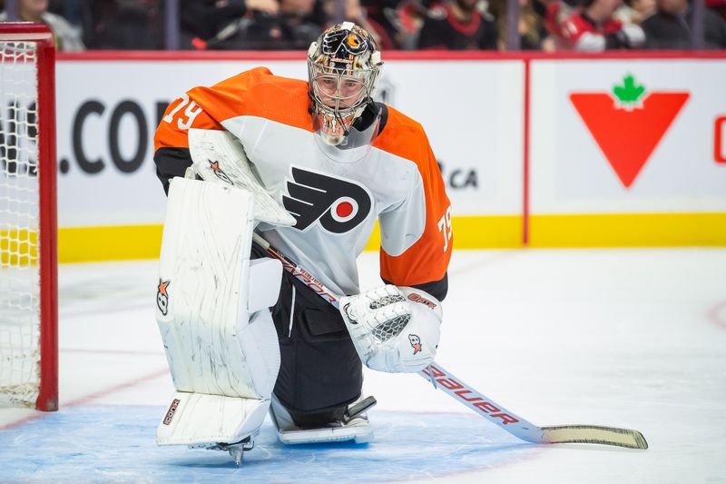 Oct 14, 2023; Ottawa, Ontario, CAN; Philadelphia Flyers goalie Carter Hart (79) stretches during a break in the first period against the Ottawa Senators at the Canadian Tire Centre. Mandatory Credit: Marc DesRosiers-USA TODAY Sports