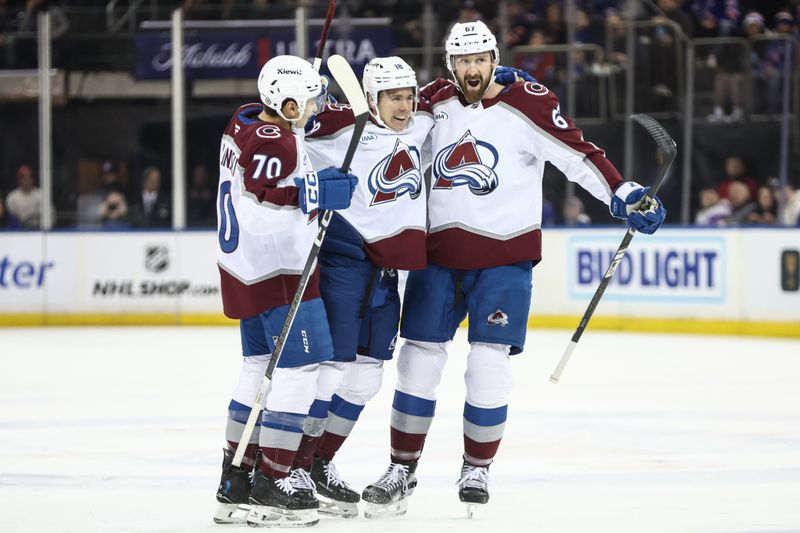 Jan 26, 2025; New York, New York, USA;  Colorado Avalanche center Jack Drury (18) celebrates with his teammates after scoring a goal in the first period against the New York Rangers at Madison Square Garden. Mandatory Credit: Wendell Cruz-Imagn Images