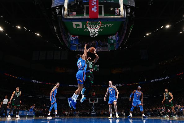 OKLAHOMA CITY, OK - JANUARY 2: Derrick White #9 of the Boston Celtics drives to the basket during the game against the Oklahoma City Thunder on January 2, 2024 at Paycom Arena in Oklahoma City, Oklahoma. NOTE TO USER: User expressly acknowledges and agrees that, by downloading and or using this photograph, User is consenting to the terms and conditions of the Getty Images License Agreement. Mandatory Copyright Notice: Copyright 2024 NBAE (Photo by Zach Beeker/NBAE via Getty Images)