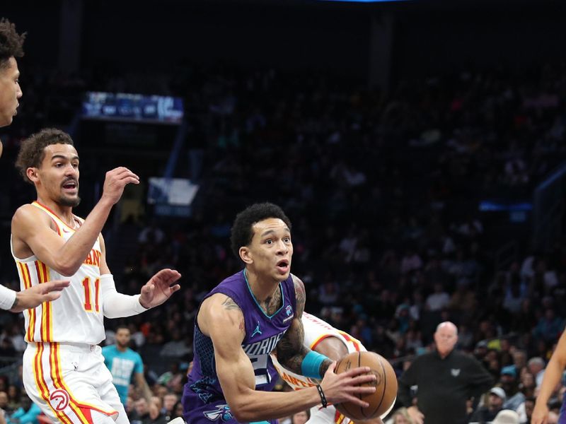 CHARLOTTE, NC - FEBRUARY 14: Kai Jones #23 of the Charlotte Hornets handles the ball during the game against the Atlanta Hawks on February 14, 2024 at Spectrum Center in Charlotte, North Carolina. NOTE TO USER: User expressly acknowledges and agrees that, by downloading and or using this photograph, User is consenting to the terms and conditions of the Getty Images License Agreement.  Mandatory Copyright Notice:  Copyright 2024 NBAE (Photo by Brock Williams-Smith/NBAE via Getty Images)