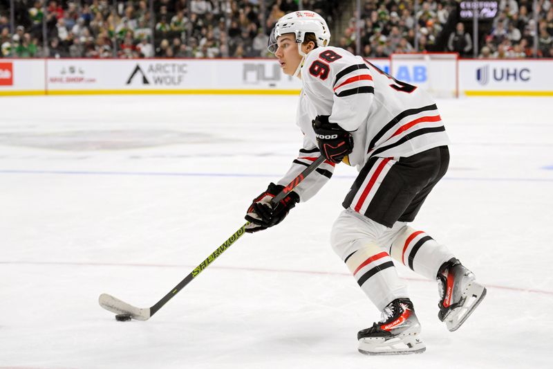 Nov 29, 2024; Saint Paul, Minnesota, USA;  Chicago Blackhawks forward Connor Bedard (98) looks to shoot against the Minnesota Wild during the third period at Xcel Energy Center. Mandatory Credit: Nick Wosika-Imagn Images