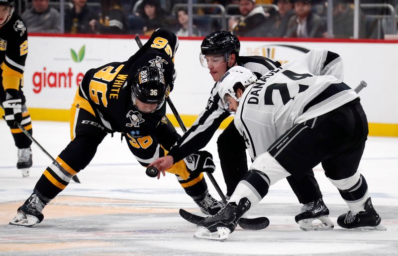 Feb 18, 2024; Pittsburgh, Pennsylvania, USA;  Pittsburgh Penguins center Colin White (36) takes a face-off against the Los Angeles Kings center Phillip Danault (24) during the third period at PPG Paints Arena. Los Angeles won 2-1. Mandatory Credit: Charles LeClaire-USA TODAY Sports