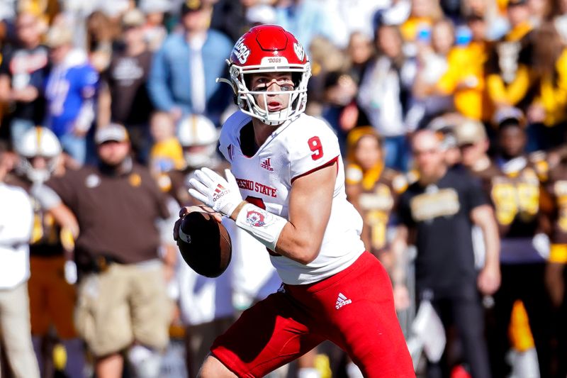 Oct 16, 2021; Laramie, Wyoming, USA; Fresno State Bulldogs quarterback Jake Haener (9) drops back to throw against the Wyoming Cowboys during the first quarter at Jonah Field at War Memorial Stadium. Mandatory Credit: Troy Babbitt-USA TODAY Sports