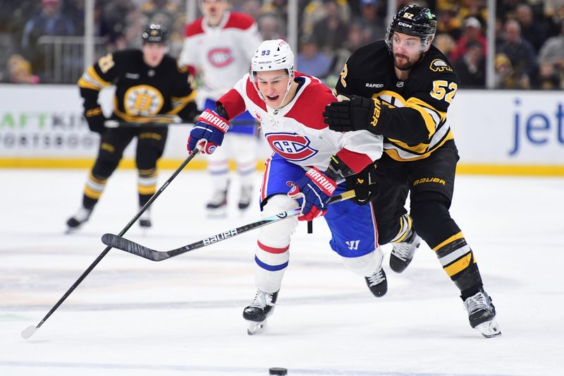 Dec 23, 2025; Boston, Massachusetts, USA; Boston Bruins center Sean Kuraly (52) and Montréal Canadiens right wing Ivan Demidov (93) battle for the puck during the second period at TD Garden. Mandatory Credit: Bob DeChiara-Imagn Images