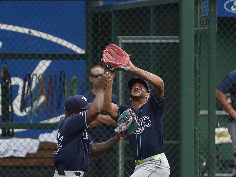 Jun 23, 2024; Pittsburgh, Pennsylvania, USA;  Tampa Bay Rays center fielder Jose Siri (22) makes a catch in front of left fielder Randy Arozarena (left) against the Pittsburgh Pirates to end the sixth inning at PNC Park. Mandatory Credit: Charles LeClaire-USA TODAY Sports