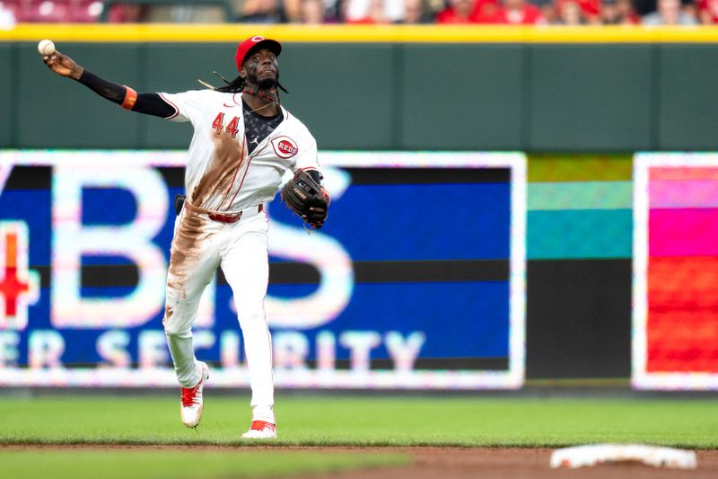 Aug 3, 2024; Cincinnati, Ohio, USA; Cincinnati Reds shortstop Elly De La Cruz (44) throws to retire San Francisco Giants shortstop Casey Schmitt (10) in the third inning at Great American Ball Park. Mandatory Credit: Albert Cesare-USA TODAY Sports