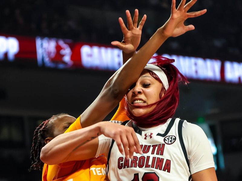Mar 3, 2024; Columbia, South Carolina, USA; South Carolina Gamecocks center Kamilla Cardoso (10) and Tennessee Lady Vols forward Jillian Hollingshead (53) battle for the ball in the first half at Colonial Life Arena. Mandatory Credit: Jeff Blake-USA TODAY Sports