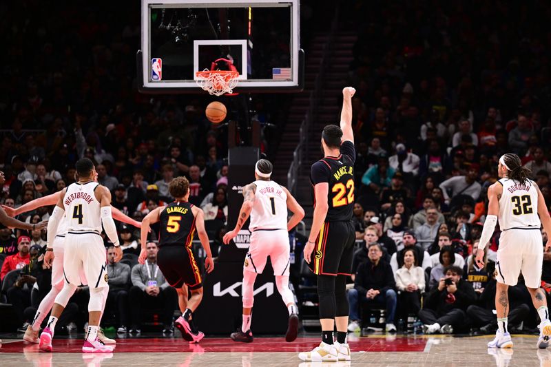 ATLANTA, GA - DECEMBER 8: Larry Nance Jr. #22 of the Atlanta Hawks shoots the ball during the game against the Denver Nuggets on December 8, 2024 at State Farm Arena in Atlanta, Georgia.  NOTE TO USER: User expressly acknowledges and agrees that, by downloading and/or using this Photograph, user is consenting to the terms and conditions of the Getty Images License Agreement. Mandatory Copyright Notice: Copyright 2024 NBAE (Photo by Adam Hagy/NBAE via Getty Images)