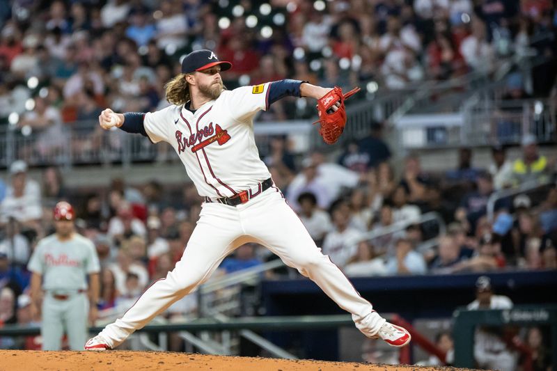 Aug 22, 2024; Cumberland, Georgia, USA; Atlanta Braves pitcher Pierce Johnson (38) pitches against the Philadelphia Phillies during the seventh inning at Truist Park. Mandatory Credit: Jordan Godfree-USA TODAY Sports