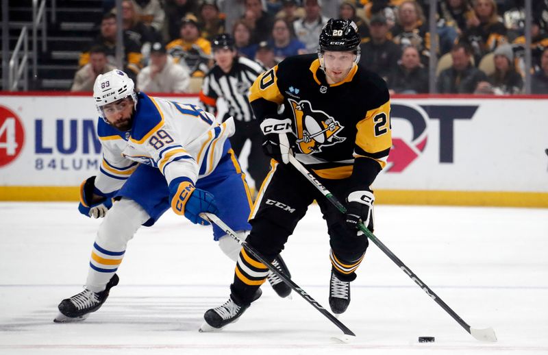 Jan 6, 2024; Pittsburgh, Pennsylvania, USA;  Pittsburgh Penguins center Lars Eller (20) skates up ice with the puck ahead of Buffalo Sabres right wing Alex Tuch (89) during the first period at PPG Paints Arena. Mandatory Credit: Charles LeClaire-USA TODAY Sports