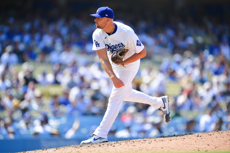 Jul 25, 2024; Los Angeles, California, USA; Los Angeles Dodgers pitcher Blake Treinen (49) throws against the San Francisco Giants during the eighth inning at Dodger Stadium. Mandatory Credit: Gary A. Vasquez-USA TODAY Sports