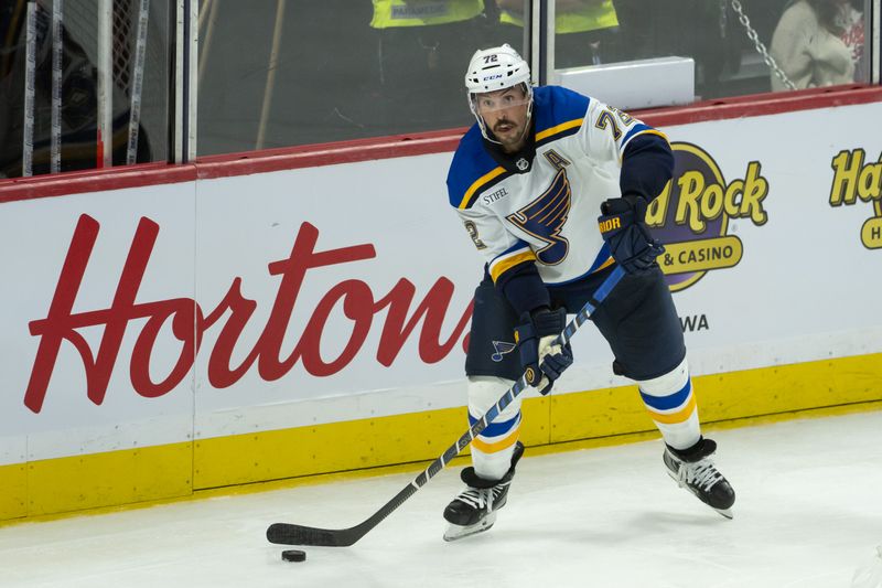 Oct 29, 2024; Ottawa, Ontario, CAN; St. Louis Blues defenseman Justin Faulk (72) moves the puck in the third period against the Ottawa Senators at the Canadian Tire Centre. Mandatory Credit: Marc DesRosiers-Imagn Images