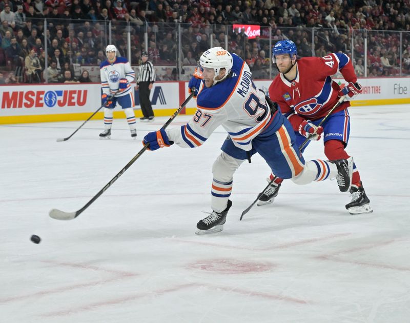 Nov 18, 2024; Montreal, Quebec, CAN; Edmonton Oilers forward Connor McDavid (97) takes a shot and Montreal Canadiens forward Joel Armia (40) defends during the third period at the Bell Centre. Mandatory Credit: Eric Bolte-Imagn Images