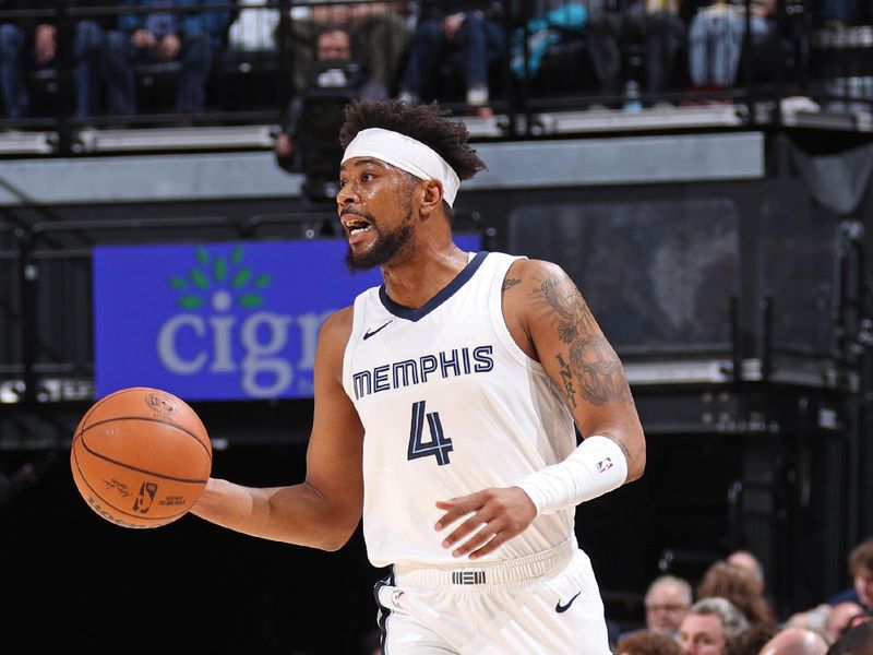 MEMPHIS, TN - FEBRUARY 15: Jordan Goodwin #4 of the Memphis Grizzlies brings the ball up court during the game against the Milwaukee Bucks on February 15, 2024 at FedExForum in Memphis, Tennessee. NOTE TO USER: User expressly acknowledges and agrees that, by downloading and or using this photograph, User is consenting to the terms and conditions of the Getty Images License Agreement. Mandatory Copyright Notice: Copyright 2024 NBAE (Photo by Stephen Gosling/NBAE via Getty Images)