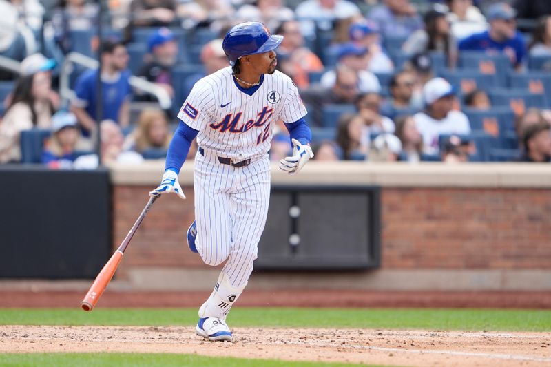 Jun 1, 2025; New York City, New York, USA; New York Mets shortstop Francisco Lindor (12) watches his home run against the Colorado Rockies during the fifth inning at Citi Field. Mandatory Credit: Gregory Fisher-Imagn Images