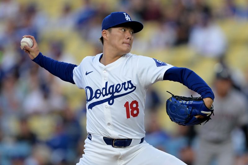 May 20, 2024; Los Angeles, California, USA;  Los Angeles Dodgers starting pitcher Yoshinobu Yamamoto (18) delivers to the plate in the first inning against the Arizona Diamondbacks at Dodger Stadium. Mandatory Credit: Jayne Kamin-Oncea-USA TODAY Sports