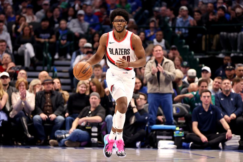 DALLAS, TEXAS - JANUARY 05: Scoot Henderson #00 of the Portland Trail Blazers dribbles the ball up court against the Dallas Mavericks in the first half at American Airlines Center on January 05, 2024 in Dallas, Texas. NOTE TO USER: User expressly acknowledges and agrees that, by downloading and or using this photograph, User is consenting to the terms and conditions of the Getty Images License Agreement. (Photo by Tim Heitman/Getty Images)