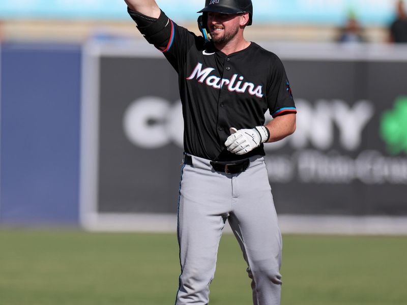 Jun 7, 2025; Tampa, Florida, USA; Miami Marlins first baseman Liam Hicks (34) reacts after hitting a two rbi double against the Tampa Bay Rays in the fifth inning at George M. Steinbrenner Field. Mandatory Credit: Nathan Ray Seebeck-Imagn Images