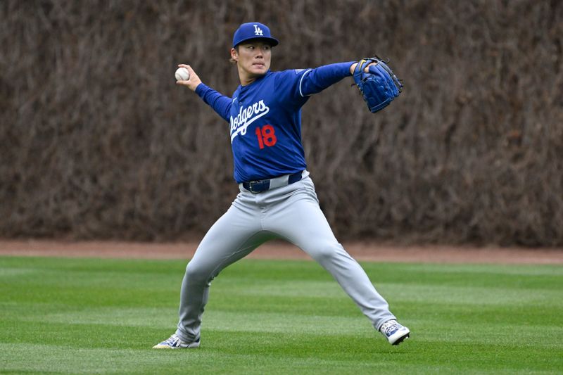 Apr 5, 2024; Chicago, Illinois, USA;  Los Angeles Dodgers pitcher Yoshinobu Yamamoto (18) warms up before the game against the Chicago Cubs at Wrigley Field. Mandatory Credit: Matt Marton-USA TODAY Sports