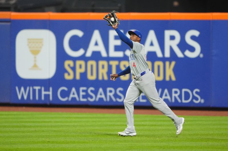 Apr 30, 2024; New York City, New York, USA; Chicago Cubs right fielder Alexander Canario (4) catches a fly ball hit by New York Mets right fielder DJ Stewart (not pictured) during the fourth inning at Citi Field. Mandatory Credit: Gregory Fisher-USA TODAY Sports