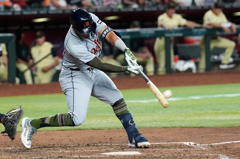 May 18, 2024; Phoenix, Arizona, USA; Detroit Tigers outfielder Wenceel Pérez (46) hits a three RBI triple against the Arizona Diamondbacks during the seventh inning at Chase Field. Mandatory Credit: Joe Camporeale-USA TODAY Sports