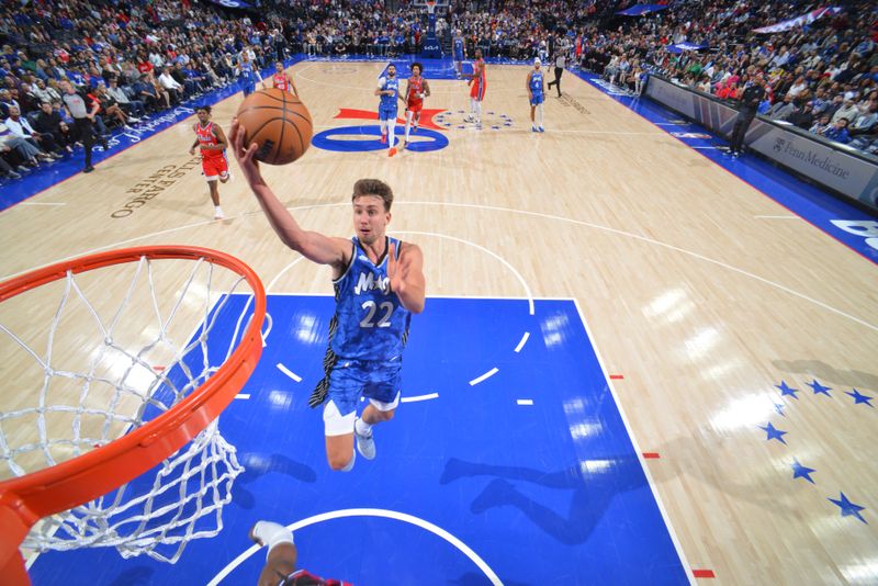 PHILADELPHIA, PA - APRIL 12: Franz Wagner #22 of the Orlando Magic drives to the basket during the game against the Philadelphia 76ers on April 12, 2024 at the Wells Fargo Center in Philadelphia, Pennsylvania NOTE TO USER: User expressly acknowledges and agrees that, by downloading and/or using this Photograph, user is consenting to the terms and conditions of the Getty Images License Agreement. Mandatory Copyright Notice: Copyright 2024 NBAE (Photo by Jesse D. Garrabrant/NBAE via Getty Images)