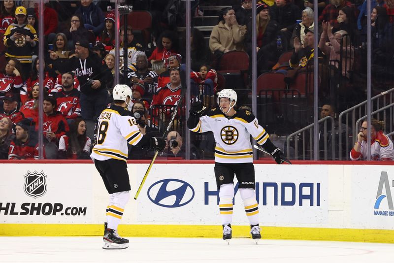 Dec 28, 2022; Newark, New Jersey, USA; Boston Bruins center Trent Frederic (11) celebrates his goal against the New Jersey Devils during the second period at Prudential Center. Mandatory Credit: Ed Mulholland-USA TODAY Sports