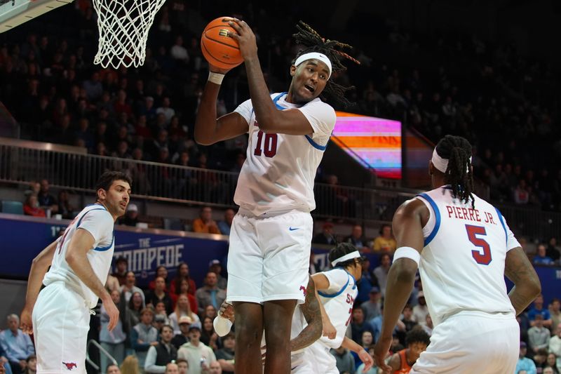 Jan 14, 2026; Dallas, Texas, USA;  SMU Mustangs center Jaden Toombs (10) grabs the defensive rebound against the Virginia Tech Hokies during the first half at Moody Coliseum. Mandatory Credit: Raymond Carlin III-Imagn Images
