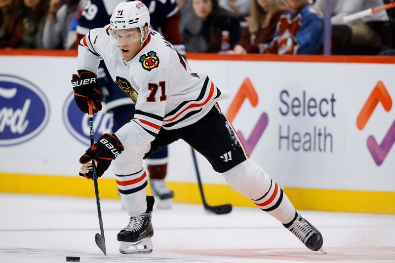 Oct 28, 2024; Denver, Colorado, USA; Chicago Blackhawks left wing Taylor Hall (71) controls the puck in the third period against the Colorado Avalanche at Ball Arena. Mandatory Credit: Isaiah J. Downing-Imagn Images