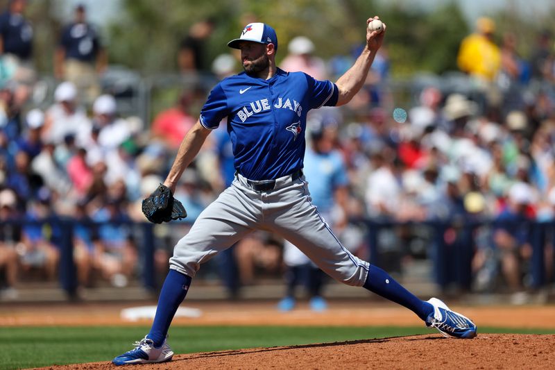 Mar 11, 2024; Port Charlotte, Florida, USA;  Toronto Blue Jays relief pitcher Tim Mayza (58) throws a pitch against the Tampa Bay Rays in the fourth inning at Charlotte Sports Park. Mandatory Credit: Nathan Ray Seebeck-USA TODAY Sports