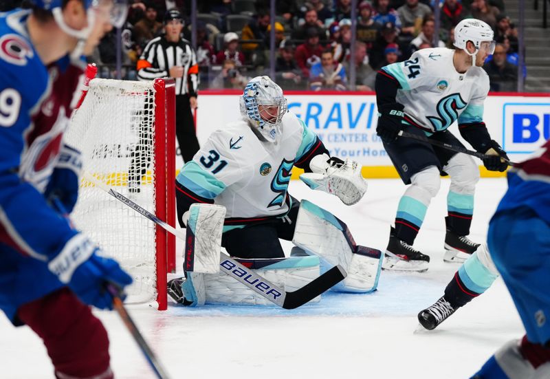 Nov 5, 2024; Denver, Colorado, USA; Seattle Kraken goaltender Philipp Grubauer (31) defends during the second period against the against the Colorado Avalanche at Ball Arena. Mandatory Credit: Ron Chenoy-Imagn Images