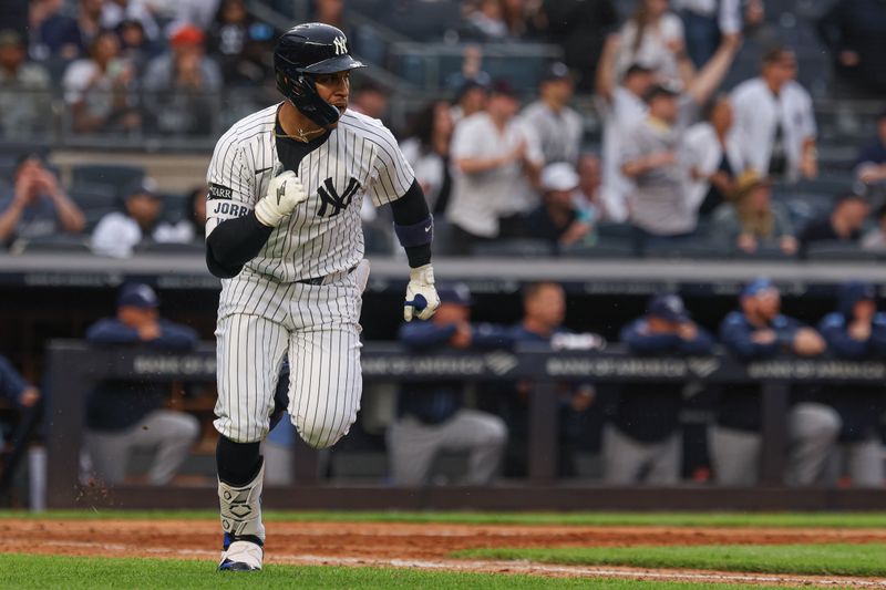 May 4, 2025; Bronx, New York, USA; New York Yankees second baseman Jorbit Vivas (90) hits a two RBI single during the eighth inning against the Tampa Bay Rays at Yankee Stadium. Mandatory Credit: Vincent Carchietta-Imagn Images