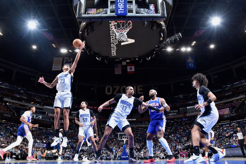 ORLANDO, FL - OCTOBER 18: Tristan da Silva #23 of the Orlando Magic rebounds the ball during the game against the Philadelphia 76ers during a NBA preseason game on October 18, 2024 at Kia Center in Orlando, Florida. NOTE TO USER: User expressly acknowledges and agrees that, by downloading and or using this photograph, User is consenting to the terms and conditions of the Getty Images License Agreement. Mandatory Copyright Notice: Copyright 2024 NBAE (Photo by Fernando Medina/NBAE via Getty Images)