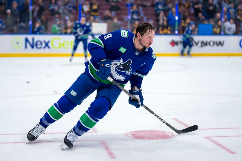 Dec 14, 2024; Vancouver, British Columbia, CAN; Vancouver Canucks forward J.T. Miller (9) skates during warm up prior to a game against the Boston Bruins at Rogers Arena. Mandatory Credit: Bob Frid-Imagn Images